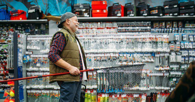 Man in bait shop with fishing net