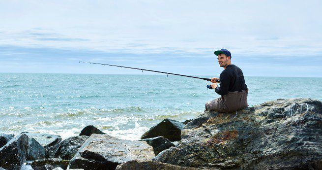 Man fishing in waders