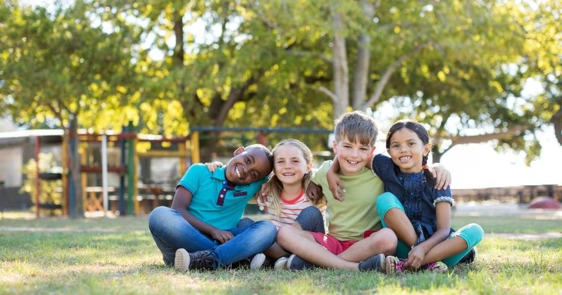 Kids sitting in a park