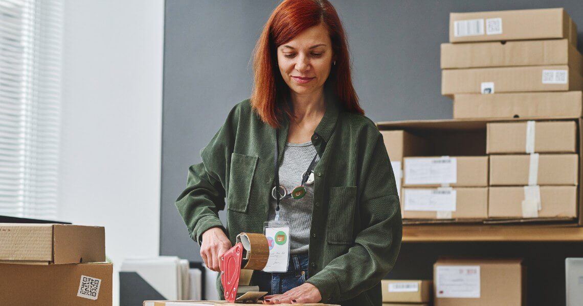 Woman packing boxes