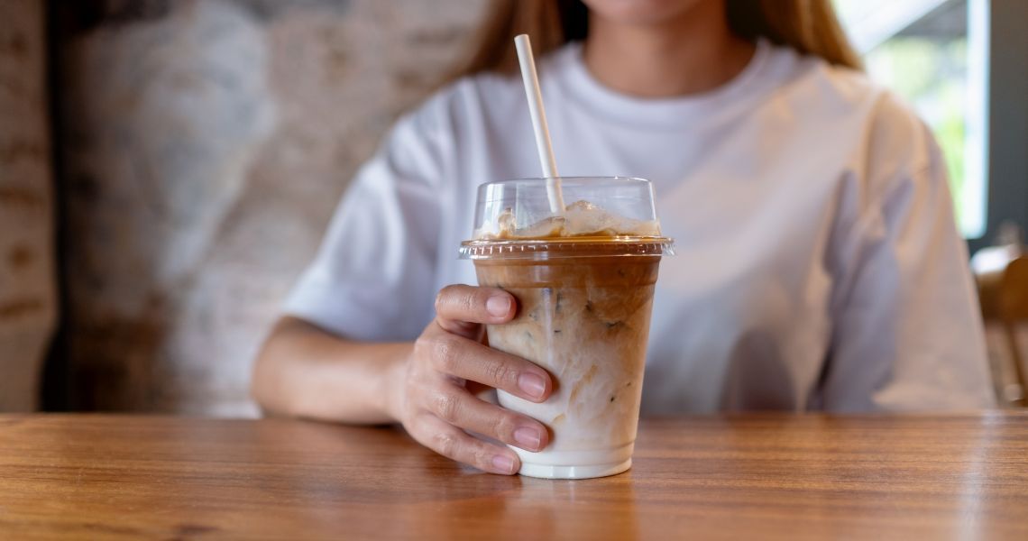 Woman drinking iced coffee