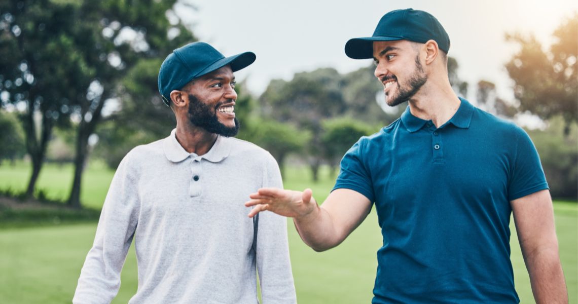 tee off at the top palacios golf course-men talking on course-4-min Men golfing