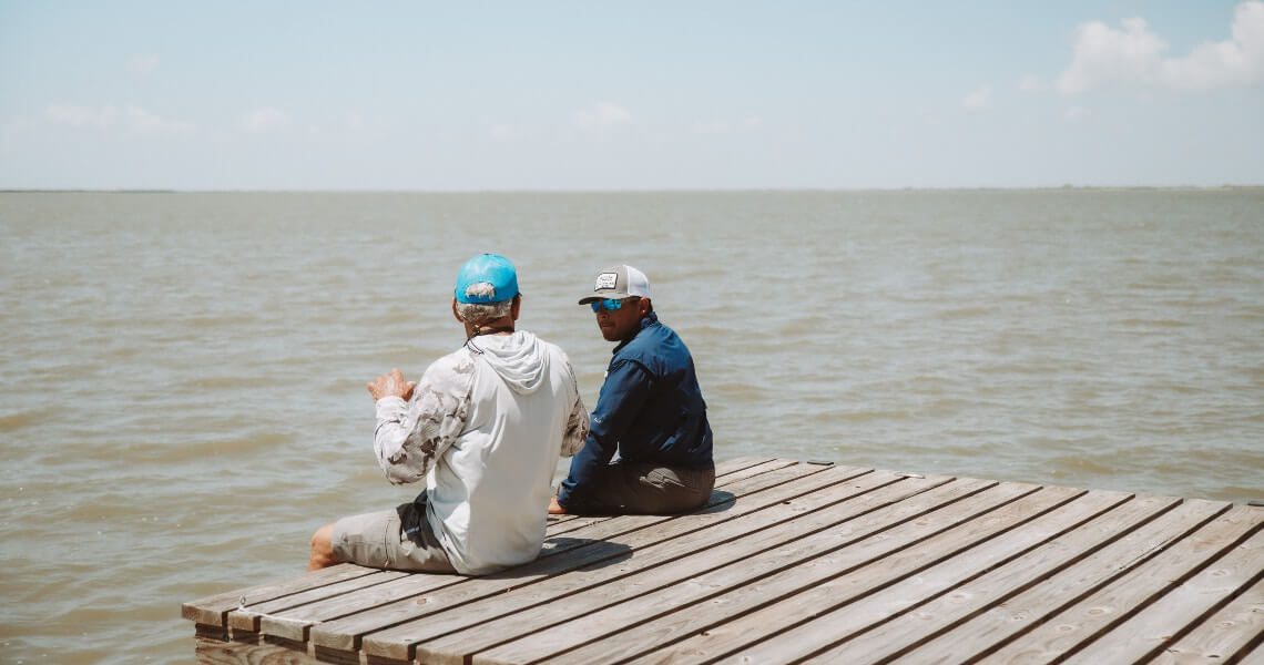 coastal water bodies near palacios, tx-two men on dock-4 coastal water bodies near palacios, tx-two men on dock-4