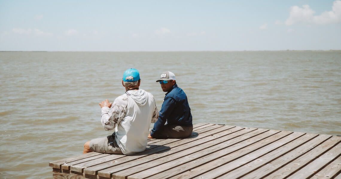 coastal water bodies near palacios, tx-two men on dock-4